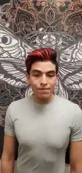 Men’s haircut with red and black highlights by Andrew Stylez Hair in Las Vegas