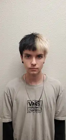 Men’s split black and blonde hair color by Andrew Stylez Hair in Las Vegas